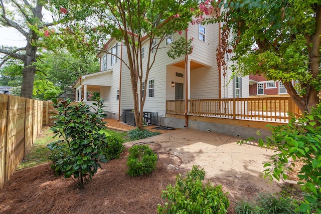 back of property featuring a patio and central air condition unit