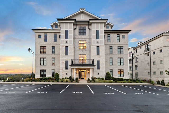 view of outdoor building at dusk