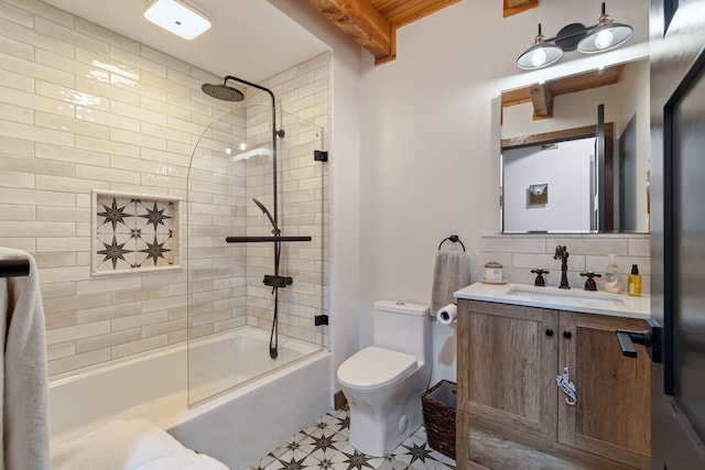 full bathroom featuring beam ceiling, backsplash, tiled shower / bath combo, vanity, and toilet