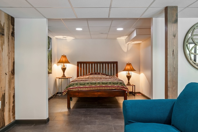 tiled bedroom with a drop ceiling