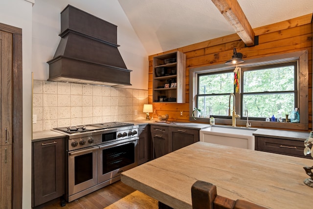 kitchen featuring dark brown cabinets, dark hardwood / wood-style flooring, custom exhaust hood, and range with two ovens