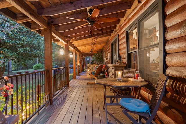 wooden deck featuring ceiling fan