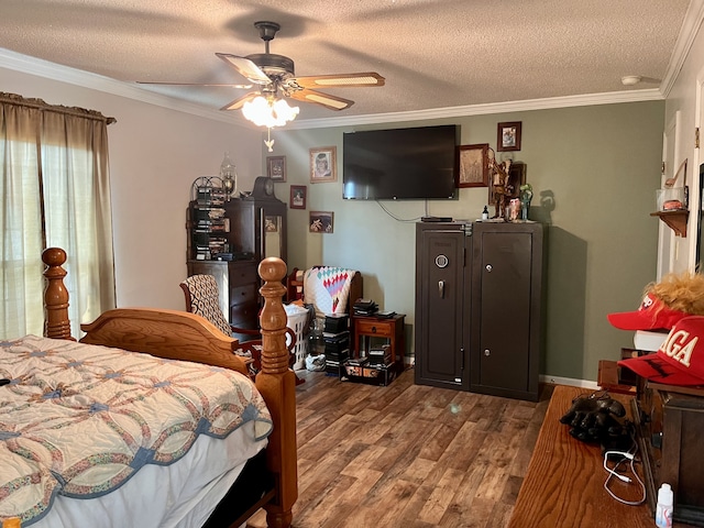 bedroom featuring a textured ceiling, crown molding, ceiling fan, and hardwood / wood-style flooring