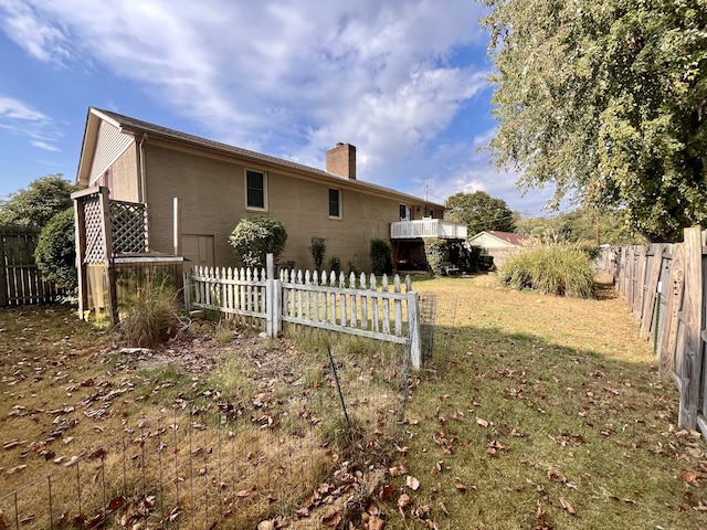 view of home's exterior with a lawn