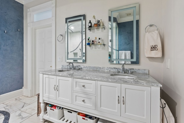 bathroom featuring vanity and ornamental molding