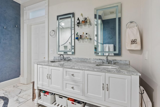 bathroom featuring marble finish floor, visible vents, a sink, and double vanity