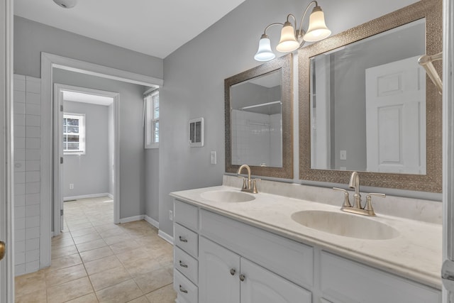 bathroom featuring tile patterned flooring and vanity