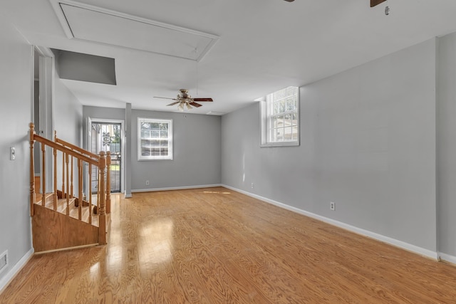 spare room with ceiling fan and light wood-type flooring