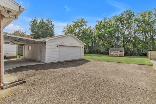 garage featuring a lawn