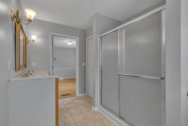 bathroom featuring an enclosed shower, hardwood / wood-style flooring, and vanity