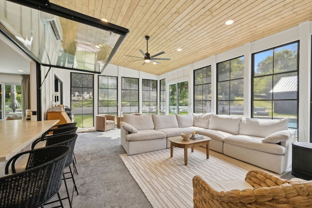 sunroom featuring wood ceiling, ceiling fan, and a healthy amount of sunlight