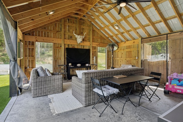 sunroom featuring vaulted ceiling and ceiling fan