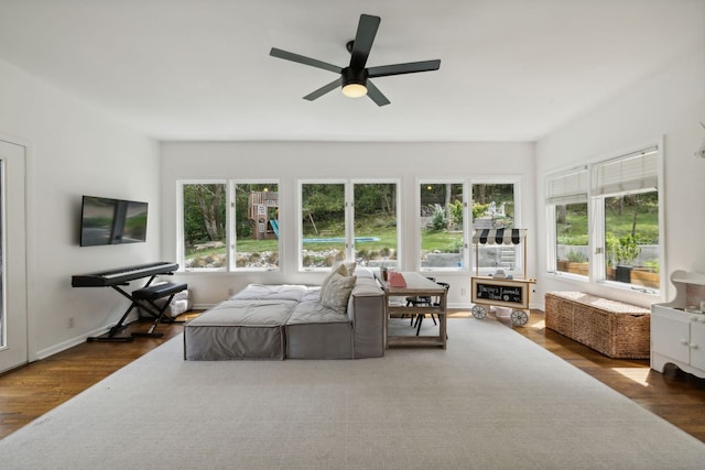 interior space with ceiling fan and dark wood-type flooring