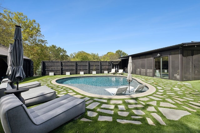 view of pool featuring a lawn and a patio area