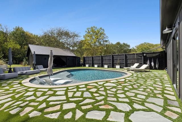 view of swimming pool featuring a patio area