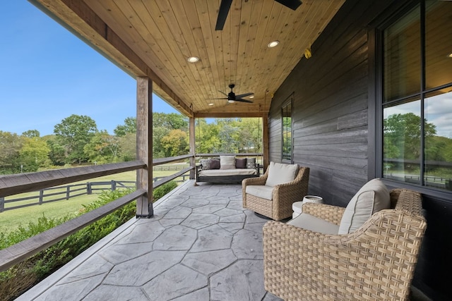 view of patio featuring ceiling fan