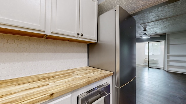 kitchen with ceiling fan, white cabinets, wine cooler, dark hardwood / wood-style flooring, and decorative backsplash