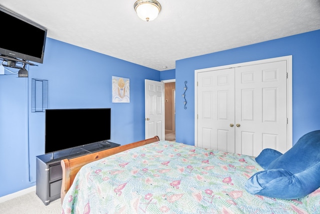 carpeted bedroom featuring a closet