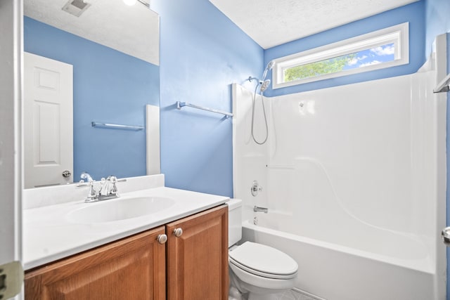 full bathroom with a textured ceiling, shower / bath combination, vanity, and toilet