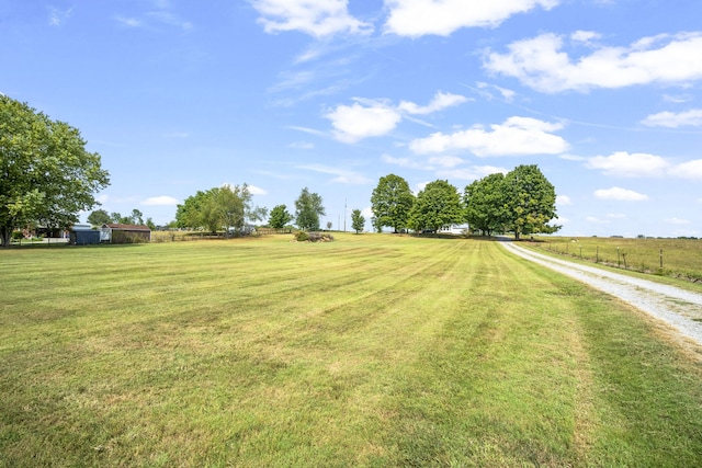 view of yard with a rural view