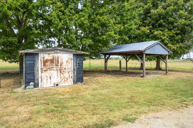 view of outbuilding with a yard