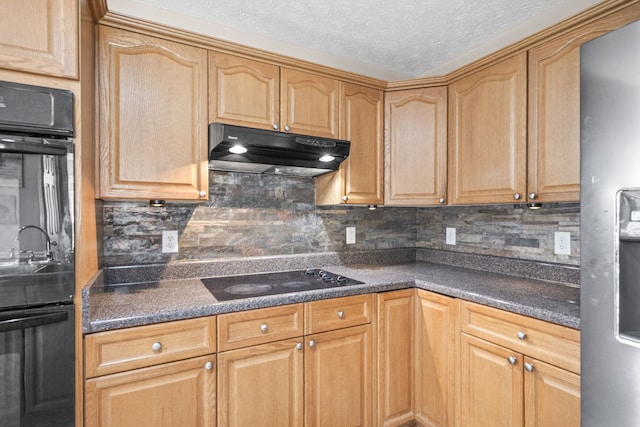 kitchen featuring a textured ceiling, decorative backsplash, and black appliances