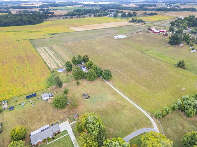 birds eye view of property with a rural view