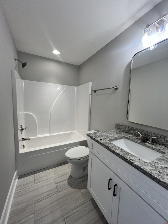 full bathroom with shower / washtub combination, vanity, and toilet