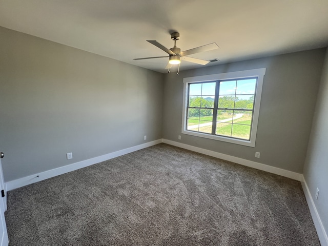 carpeted empty room featuring ceiling fan