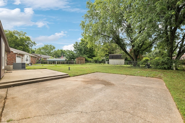 view of patio with a shed and central AC