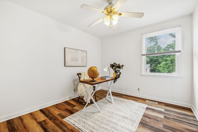 living area featuring ceiling fan and wood-type flooring