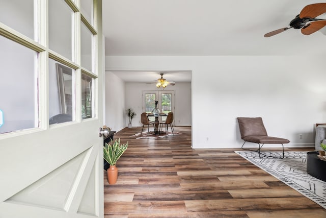 sitting room with ceiling fan, french doors, and dark hardwood / wood-style flooring