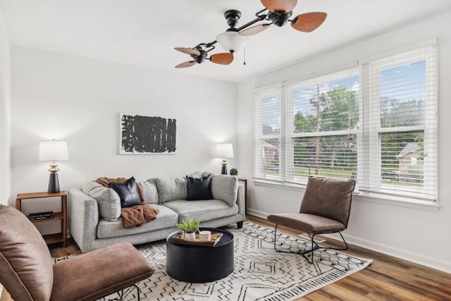 living room with ceiling fan, hardwood / wood-style floors, and a wealth of natural light