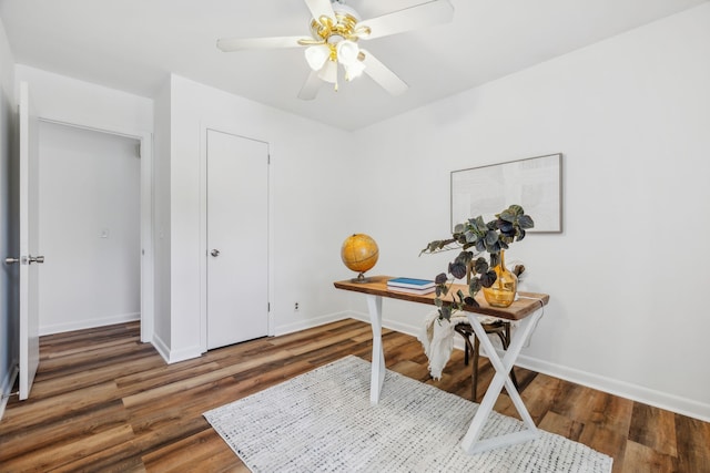 office area with ceiling fan and dark hardwood / wood-style flooring