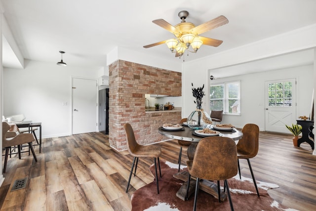 dining room featuring ceiling fan and hardwood / wood-style floors