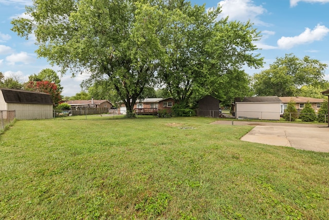 view of yard with a patio area and an outdoor structure