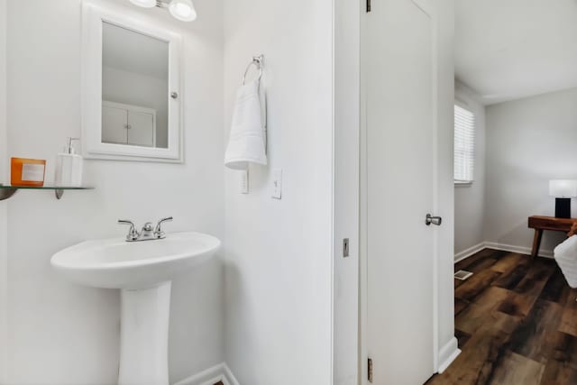 bathroom featuring sink and hardwood / wood-style floors