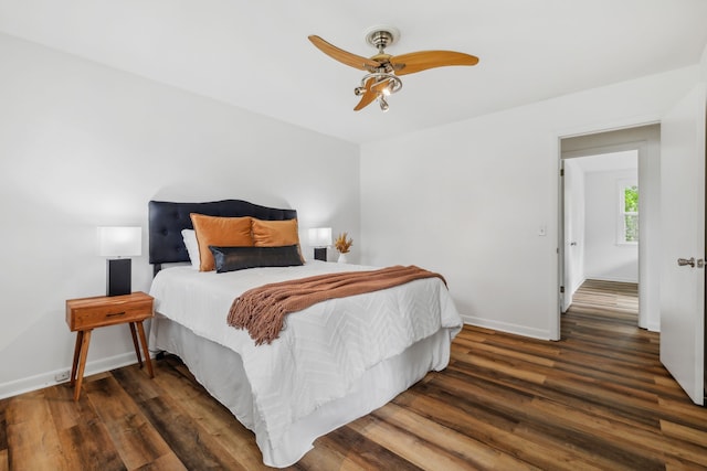 bedroom featuring ceiling fan and dark wood-type flooring