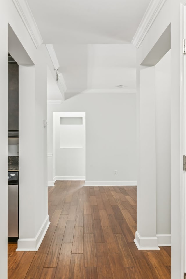 hall with ornamental molding and hardwood / wood-style flooring