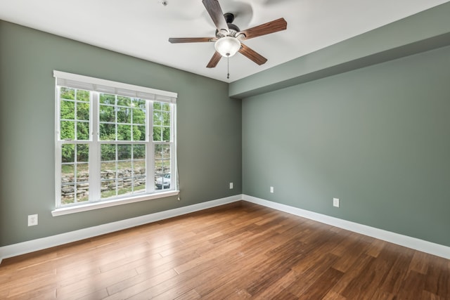 unfurnished room featuring wood-type flooring and ceiling fan