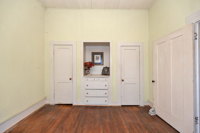 unfurnished bedroom with dark hardwood / wood-style floors