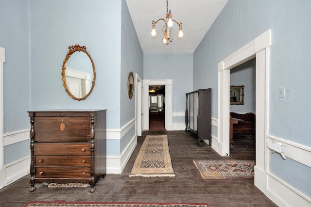 foyer featuring a notable chandelier and dark hardwood / wood-style floors