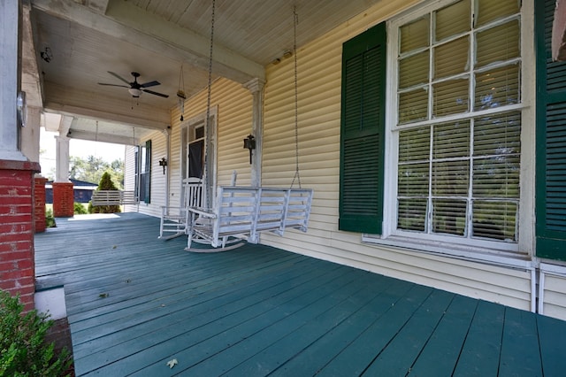 wooden deck with ceiling fan and covered porch