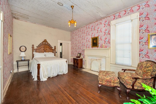395 Case Rd, Prospect, TN 38477 - bedroom with wallpapered walls, hardwood / wood-style floors, and a fireplace