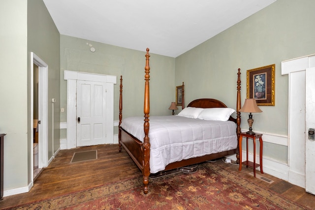 bedroom featuring dark hardwood / wood-style floors