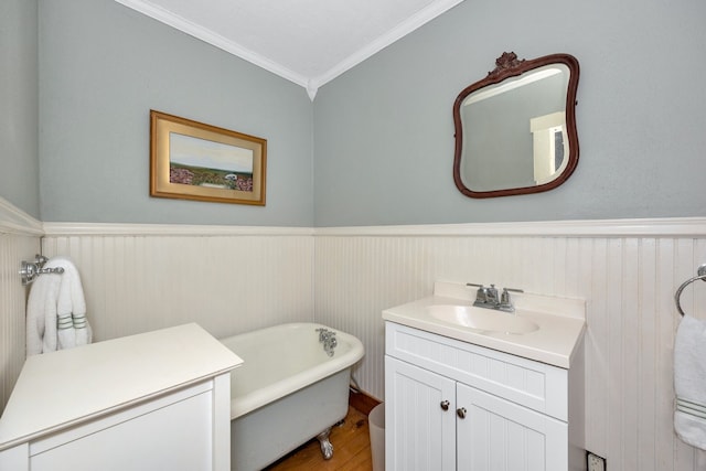 bathroom featuring crown molding, vanity, a tub, and wood-type flooring