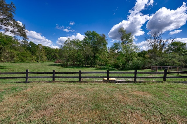 view of yard with a rural view