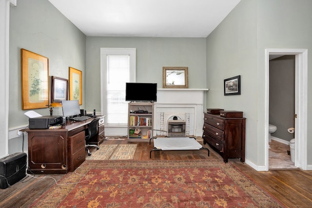 office space with dark hardwood / wood-style flooring