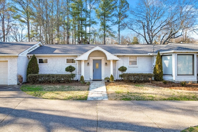 single story home featuring a garage