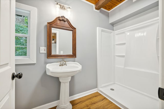 bathroom with walk in shower, wood-type flooring, wood ceiling, and beam ceiling